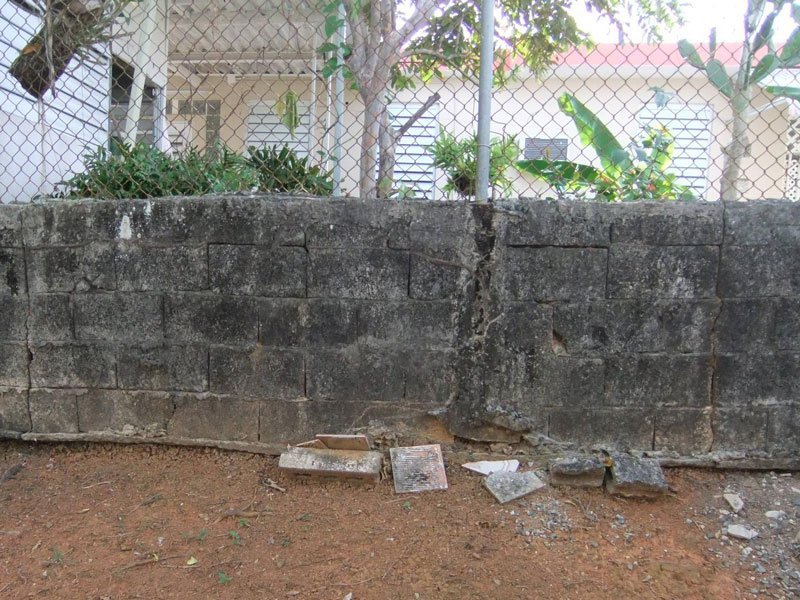 broken-cmu-wall Trex Fencing vs. Masonry 7